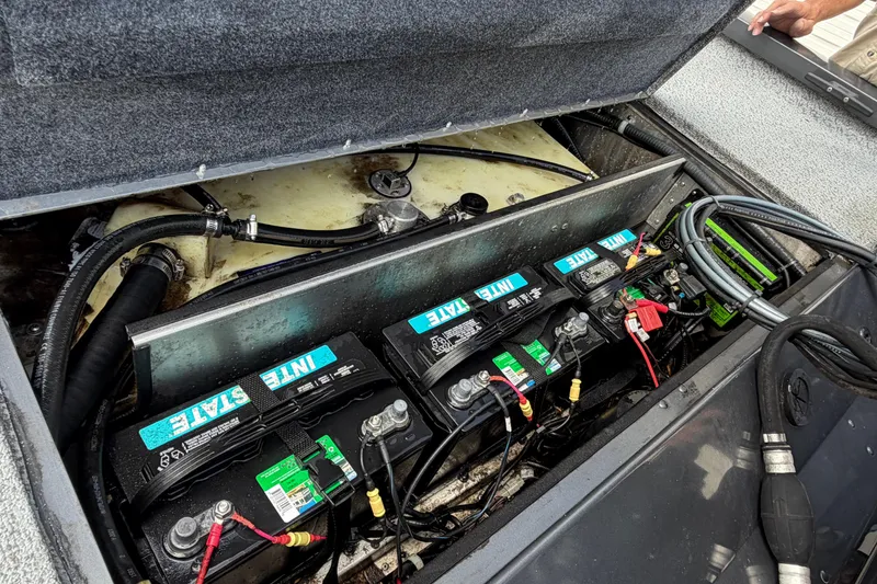 Slide: The Image of 2022 G3 Sportsman 1710 boat battery compartment with multiple Interstate batteries. - 15