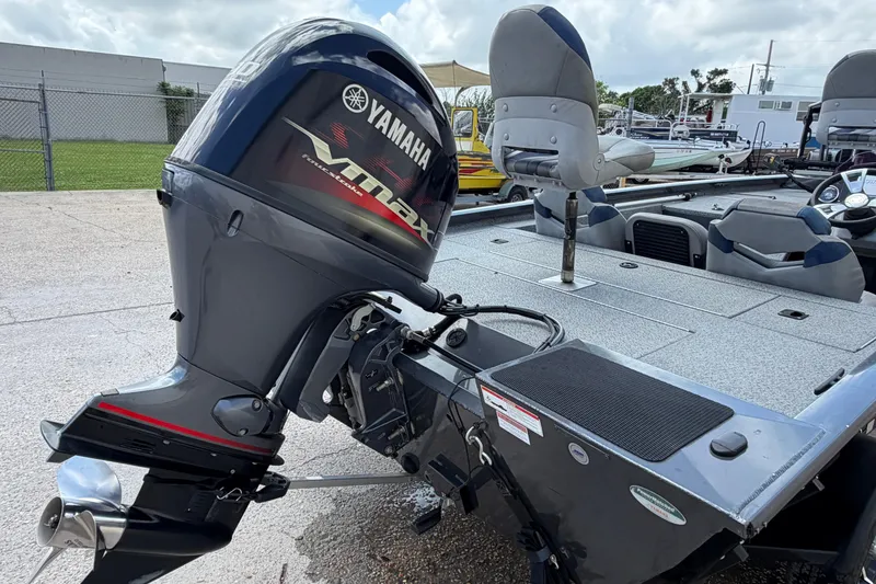 Slide: The Image of 2022 G3 Sportsman 1710 boat with Yamaha VMAX outboard motor, parked outdoors. - 17