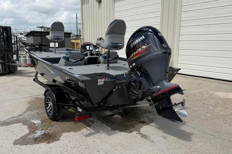 Slide: The Image of 2022 G3 Sportsman 1710 boat with Yamaha outboard motor, parked outdoors. - 3