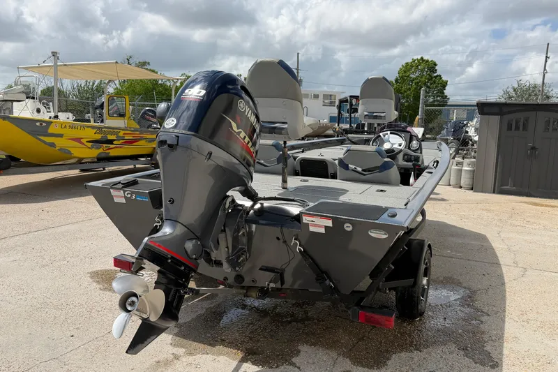 Slide: The Image of 2022 G3 Sportsman 1710 boat with Yamaha outboard motor, parked outdoors. - 4