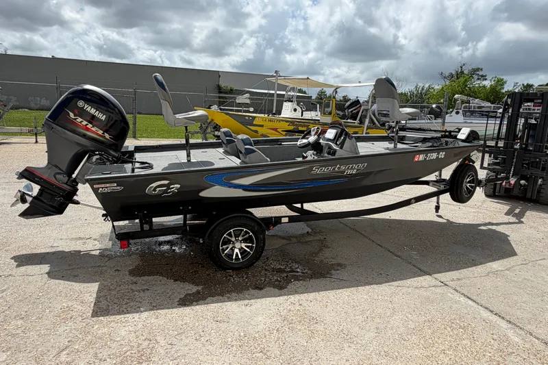 Slide: The Image of 2022 G3 Sportsman 1710 boat with Yamaha motor on trailer, parked outdoors. - 5