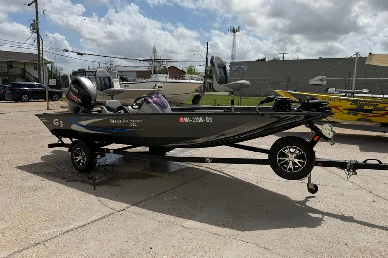 Slide: The Image of 2022 G3 Sportsman 1710 boat on trailer in outdoor setting. - 6