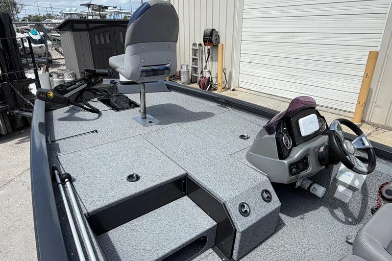 Slide: The Image of 2022 G3 Sportsman 1710 boat interior with steering console and seating. - 8