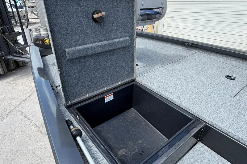 Slide: The Image of Open storage compartment on 2022 G3 Sportsman 1710 boat deck. - 9