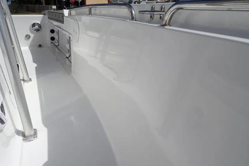 Slide: The Image of 2005 Sea Pro 206 Center Console boat interior with sleek white finish and stainless steel fittings. - 14