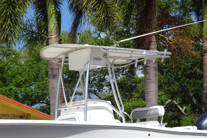 Slide: The Image of 2005 Sea Pro 206 Center Console boat with T-top, surrounded by palm trees. - 6