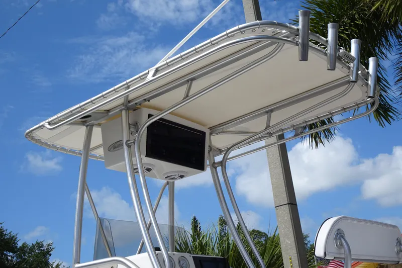 Slide: The Image of T-top of 2005 Sea Pro 206 Center Console boat against blue sky background. - 8