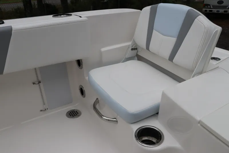 Slide: The Image of 2026 Robalo R180 Center Console boat seat with cup holder and sleek design. - 10