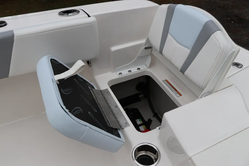 Slide: The Image of 2026 Robalo R180 Center Console boat seat with storage compartment open. - 11