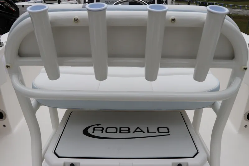 Slide: The Image of 2026 Robalo R180 Center Console boat seat with rod holders and logo. - 17