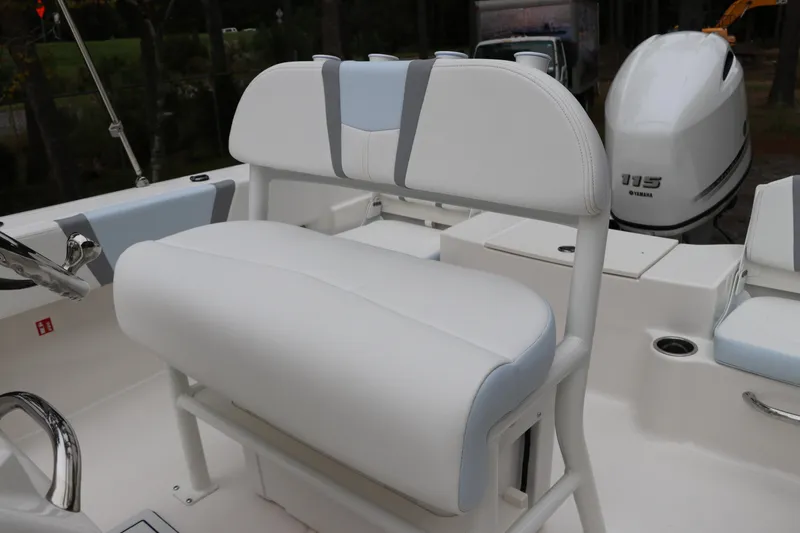 Slide: The Image of 2026 Robalo R180 Center Console boat interior with white seating and Yamaha 115 engine. - 20