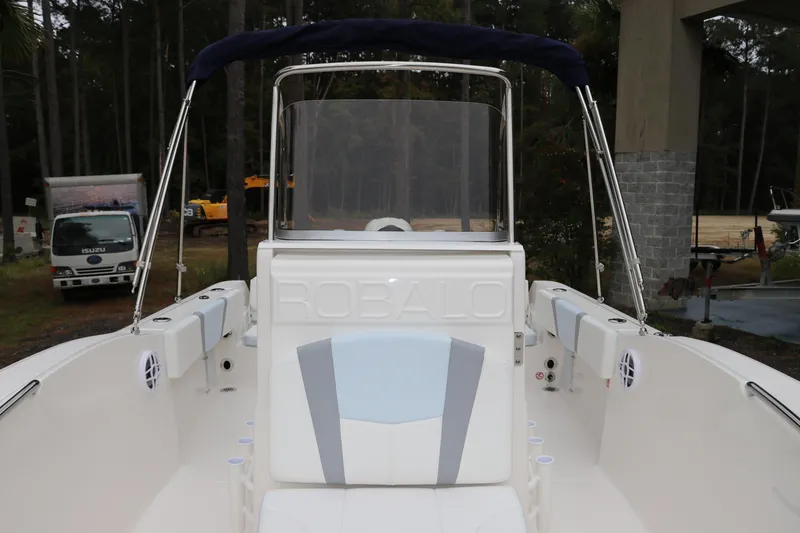 Slide: The Image of 2026 Robalo R180 Center Console boat with sleek design and spacious seating. - 31