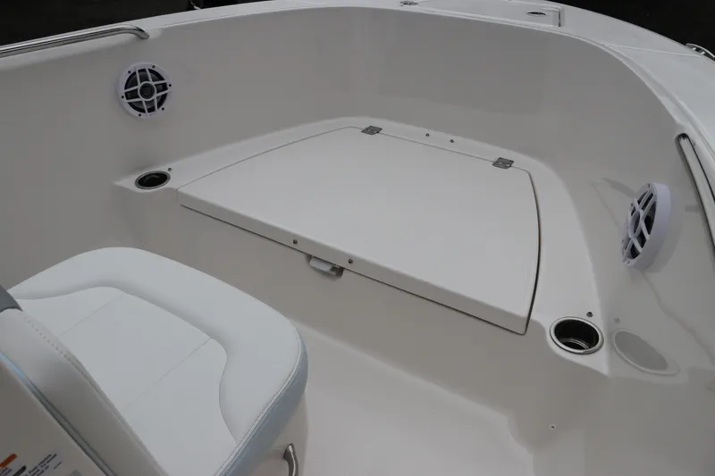 Slide: The Image of 2026 Robalo R180 Center Console boat interior with seating and storage compartment. - 36