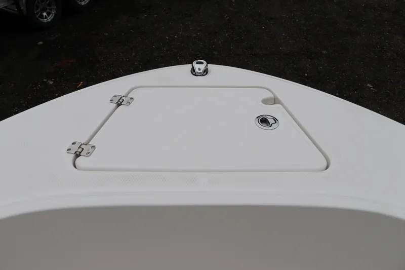 Slide: The Image of 2026 Robalo R180 Center Console boat deck with storage hatch. - 38