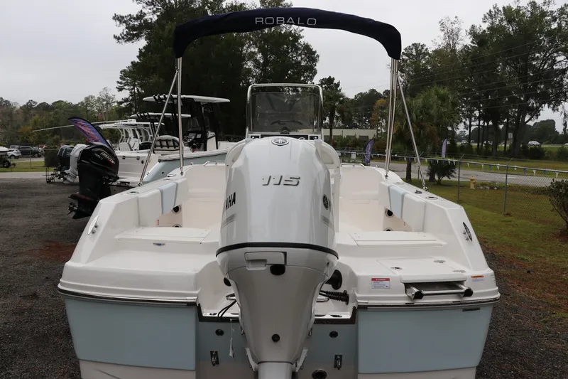 Slide: The Image of 2026 Robalo R180 Center Console boat with Yamaha engine, displayed outdoors. - 5