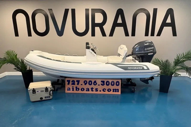 The Image of 2026 Novurania DL 360 boat displayed indoors with Yamaha engine and contact information. - 0
