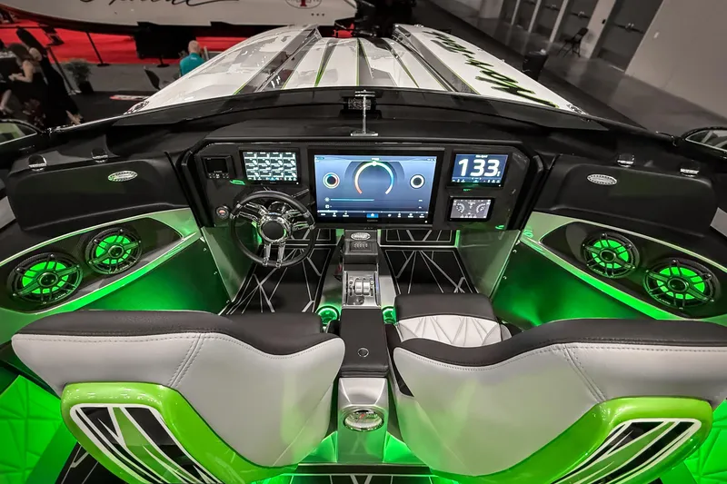 Slide: The Image of Cockpit of 2027 Nor-Tech 4000 Roadster with advanced controls and green ambient lighting. - 10