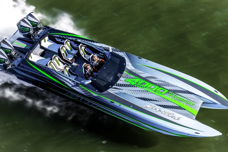 Slide: The Image of 2027 Nor-Tech 4000 Roadster speedboat with sleek design and vibrant green accents on water. - 6