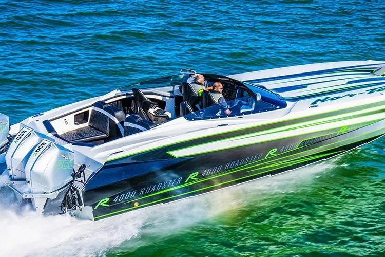 Slide: The Image of 2027 Nor-Tech 4000 Roadster speedboat cruising on vibrant blue water. - 7