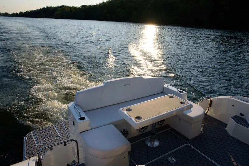 Slide: The Image of 2012 Cruisers Yachts 48 Cantius cruising on a serene lake at sunset. - 13