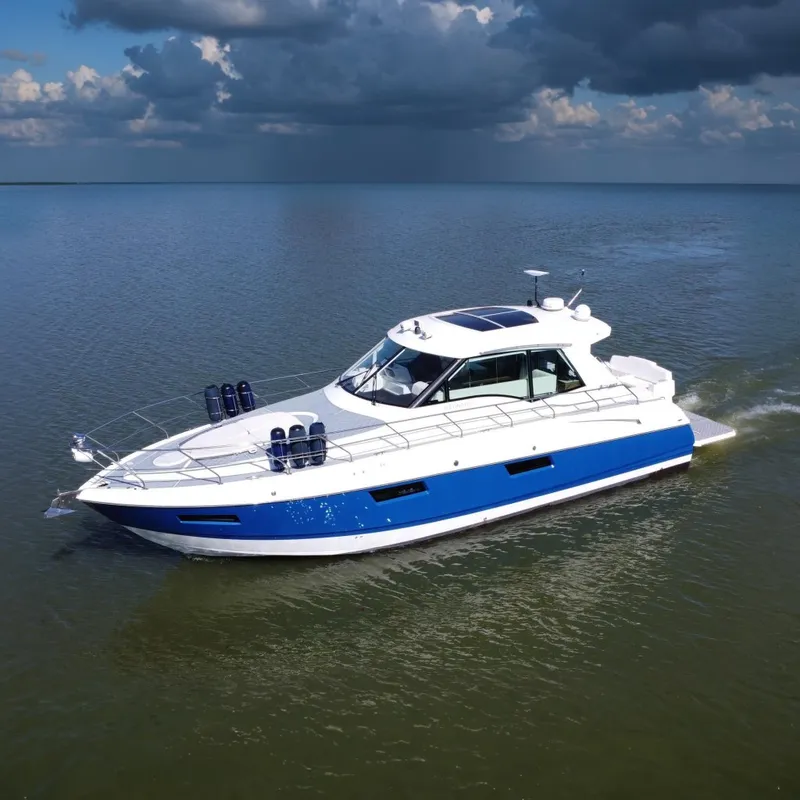 The Image of 2012 Cruisers Yachts 48 Cantius cruising on a calm lake. - 0