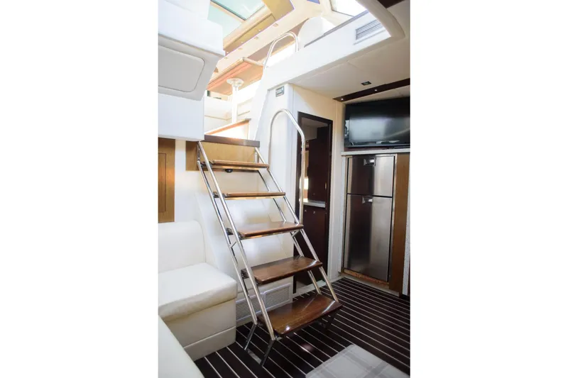 Slide: The Image of Interior of 2012 Cruisers Yachts 48 Cantius with stairs and modern kitchen. - 26