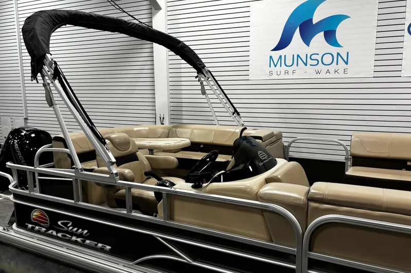 Slide: The Image of 2018 Sun Tracker Party Barge 20 DLX pontoon boat in showroom setting. - 20