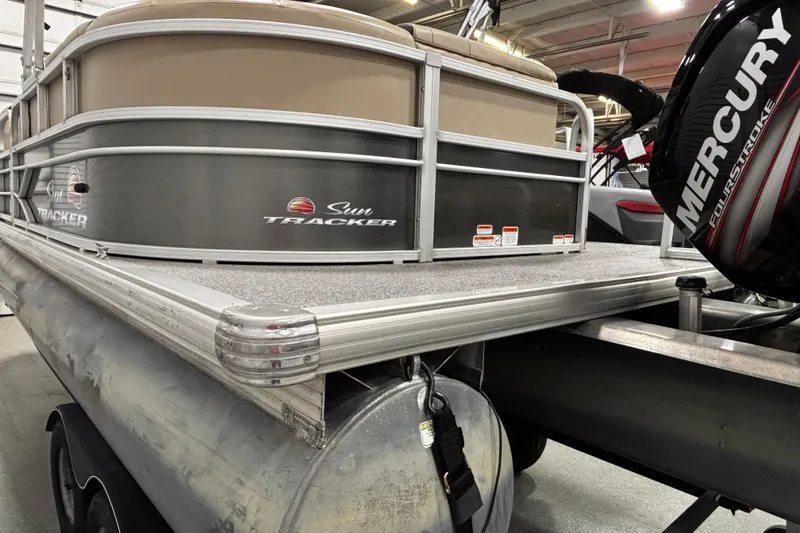 Slide: The Image of 2018 Sun Tracker Party Barge 20 DLX pontoon boat with Mercury engine in showroom. - 27