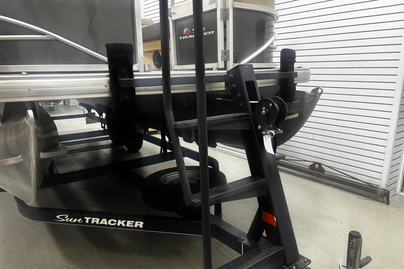 Slide: The Image of 2018 Sun Tracker Party Barge 20 DLX pontoon boat on trailer in showroom. - 28