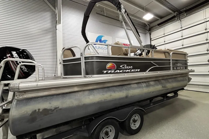 Slide: The Image of 2018 Sun Tracker Party Barge 20 DLX pontoon boat in a garage setting. - 9