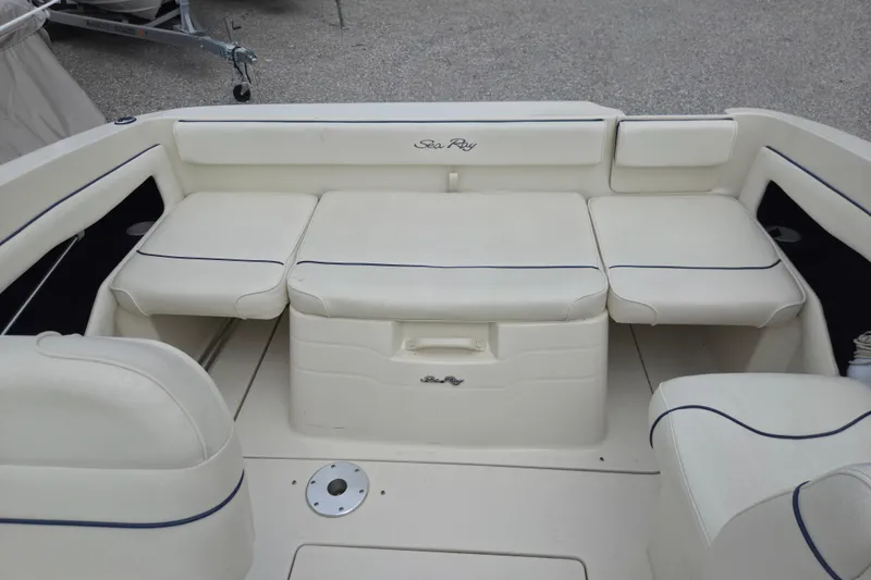 Slide: The Image of Interior seating of a 2000 Sea Ray 215 Express Cruiser boat. - 4