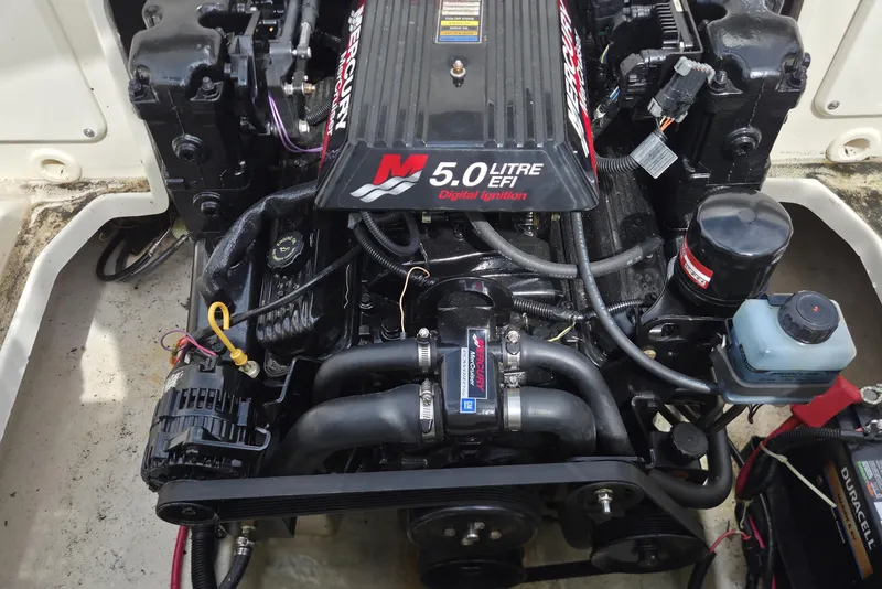 Slide: The Image of Engine of a 2000 Sea Ray 215 Express Cruiser, featuring a 5.0L EFI Mercury motor. - 7