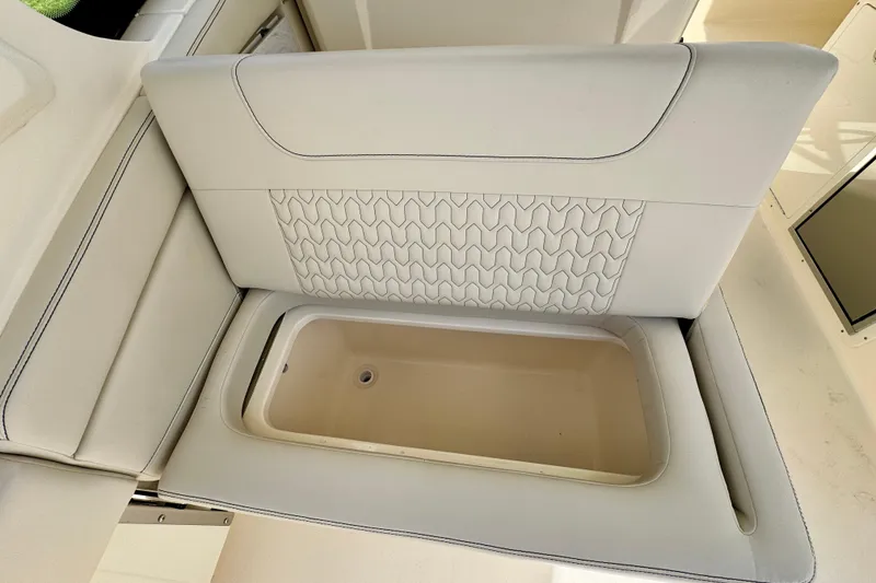 Slide: The Image of 2027 Scout 288 Dorado boat seat with integrated storage compartment. - 12