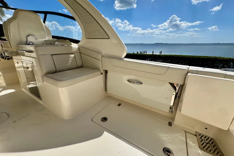 Slide: The Image of Luxurious interior of 2027 Scout 288 Dorado boat with scenic waterfront view. - 13