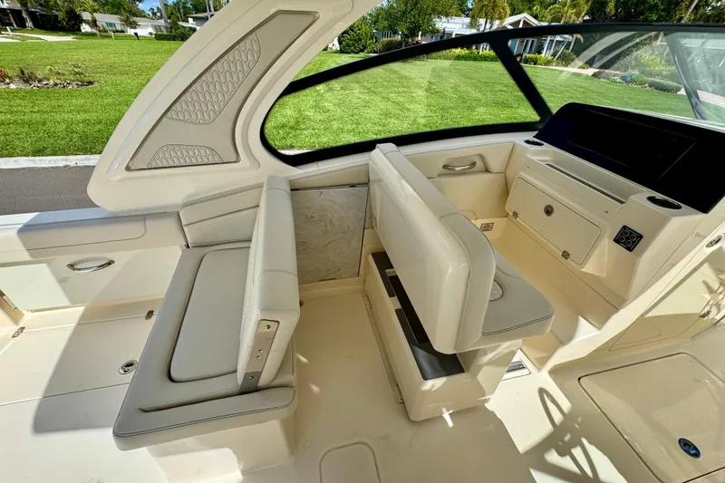 Slide: The Image of 2027 Scout 288 Dorado boat interior with luxurious seating and modern dashboard design. - 21