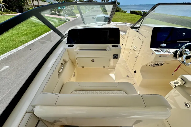 Slide: The Image of 2027 Scout 288 Dorado boat interior with modern dashboard and comfortable seating. - 25