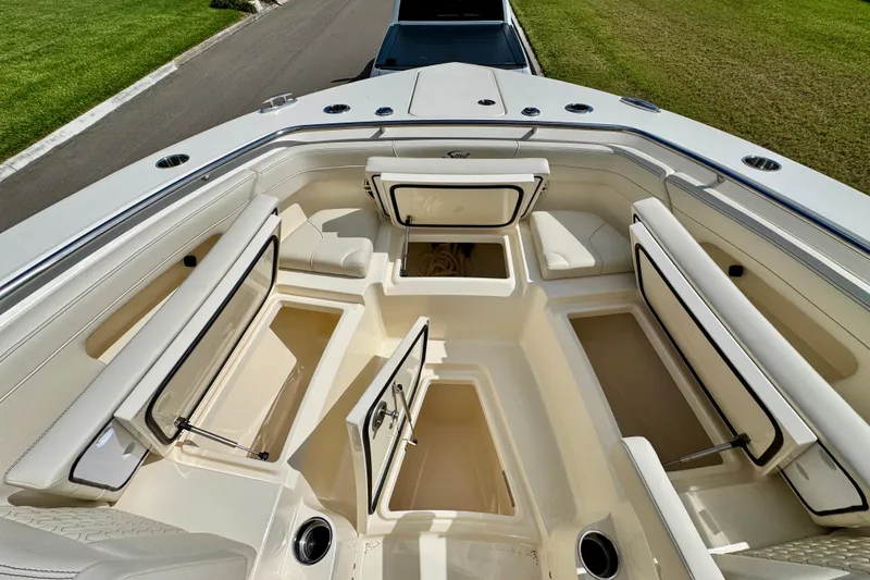 Slide: The Image of 2027 Scout 288 Dorado boat interior with open storage compartments and seating. - 35
