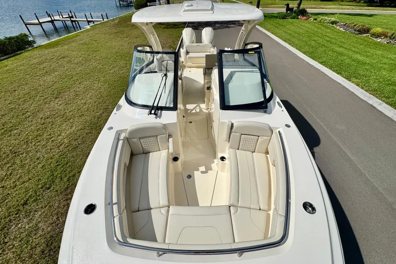 Slide: The Image of 2027 Scout 288 Dorado boat with spacious seating, dockside view. - 37