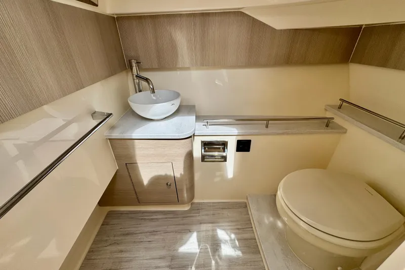 Slide: The Image of Modern bathroom interior of 2027 Scout 288 Dorado boat, featuring sleek sink and toilet design. - 40