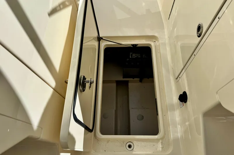 Slide: The Image of Open storage compartment on 2027 Scout 288 Dorado boat, showcasing interior space. - 44
