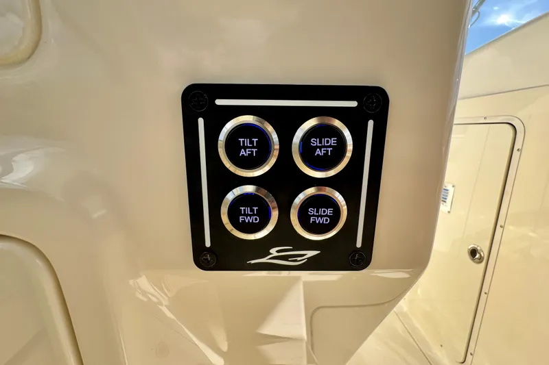 Slide: The Image of Control panel on 2027 Scout 288 Dorado boat with tilt and slide buttons. - 46