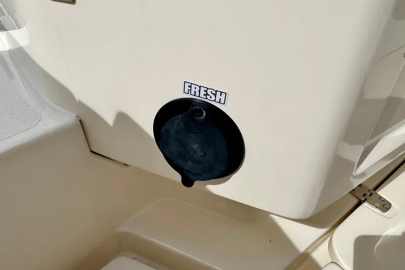 Slide: The Image of Freshwater access on 2027 Scout 288 Dorado boat, featuring a labeled cap. - 49