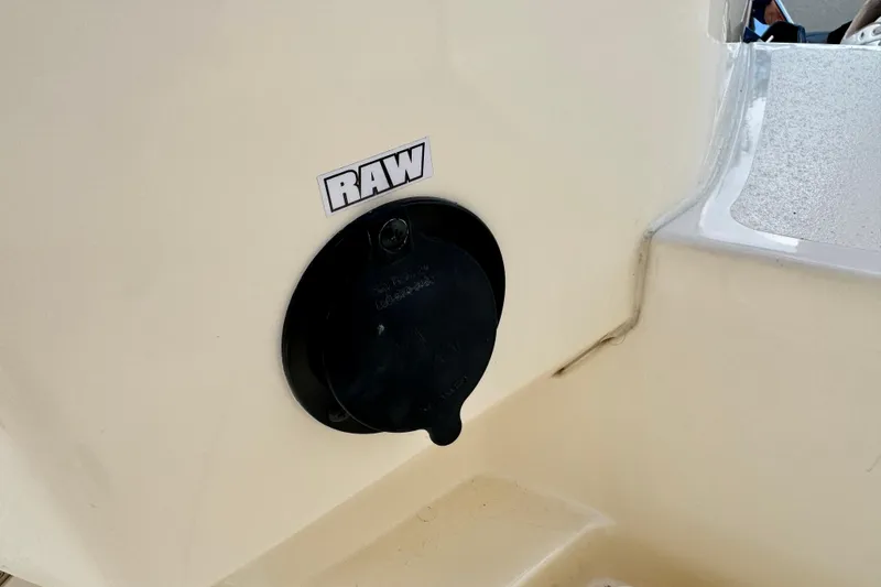 Slide: The Image of 2027 Scout 288 Dorado boat detail with "RAW" label on beige surface. - 50