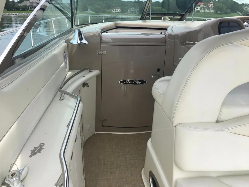 Slide: The Image of 2000 Sea Ray 410 Sundancer interior with beige seating and cabinetry. - 12