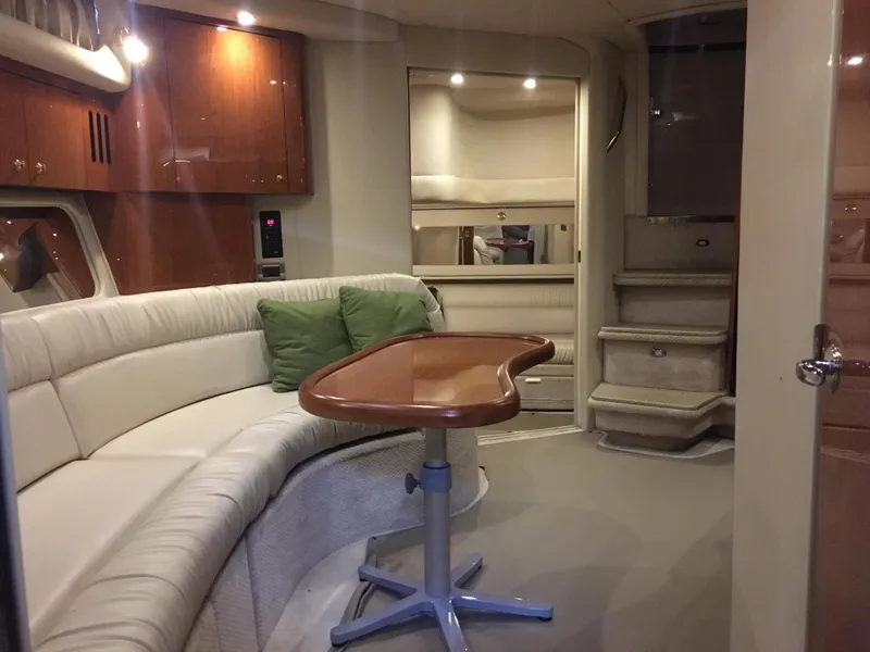 Slide: The Image of Interior of 2000 Sea Ray 410 Sundancer yacht with seating and table. - 34