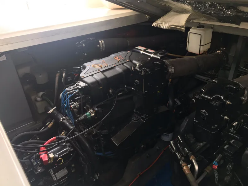 Slide: The Image of Engine compartment of a 2000 Sea Ray 410 Sundancer boat, showcasing mechanical components. - 45