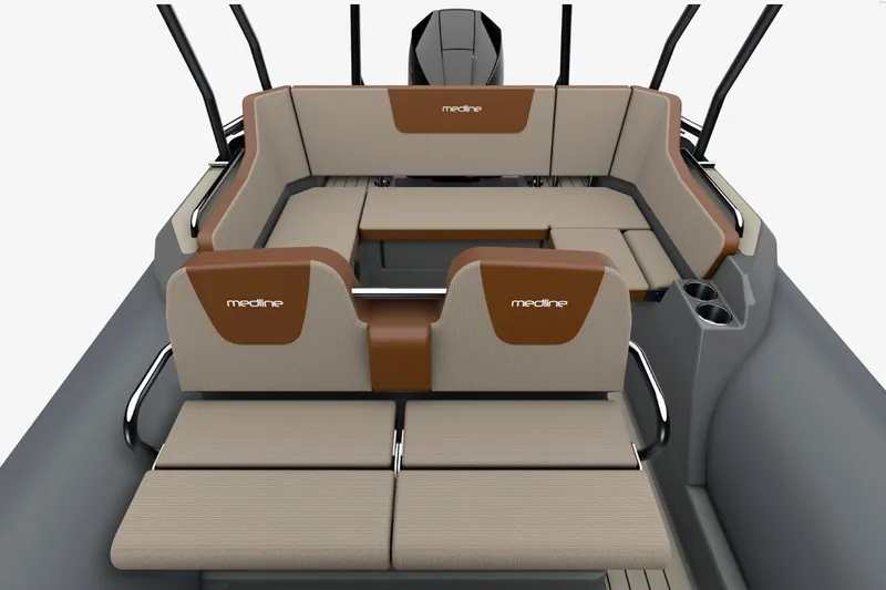 Slide: The Image of 2026 Zodiac Medline 6.8 boat interior with beige and brown seating, featuring cup holders. - 10