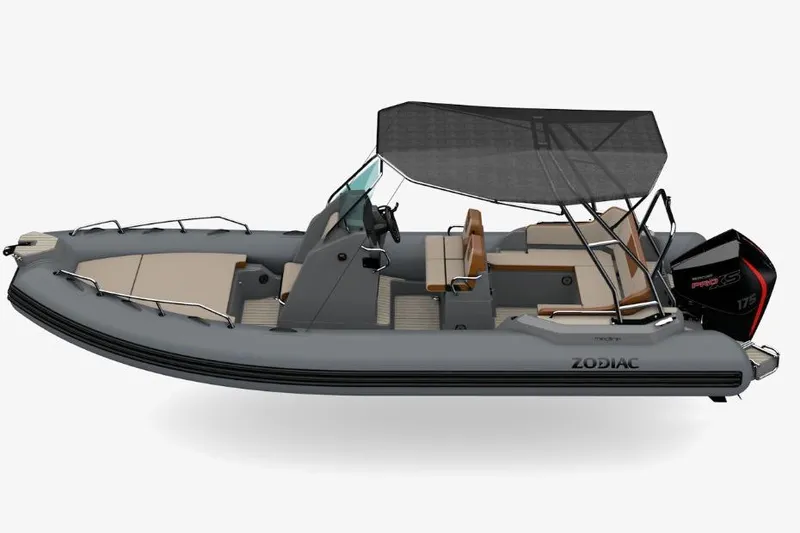 Slide: The Image of 2026 Zodiac Medline 6.8 boat with canopy, sleek design, and powerful outboard motor. - 6