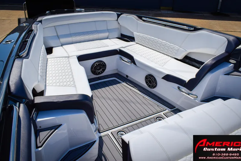 Slide: The Image of Luxurious seating area of 2027 Nor-Tech 450 Sport Center Console boat with sleek design. - 13