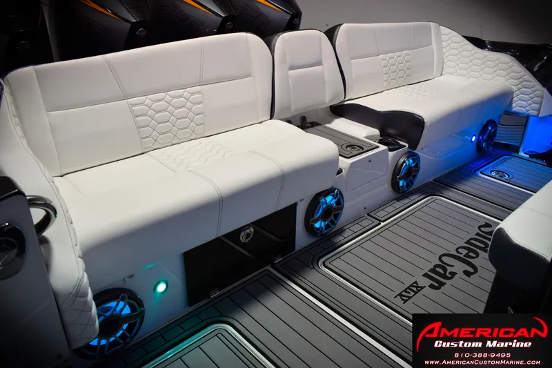 Slide: The Image of Luxurious seating on 2027 Nor-Tech 450 Sport Center Console with modern design and ambient lighting. - 16